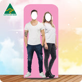 Cardboard cutout of a man and woman with Australian Made logo on pink background